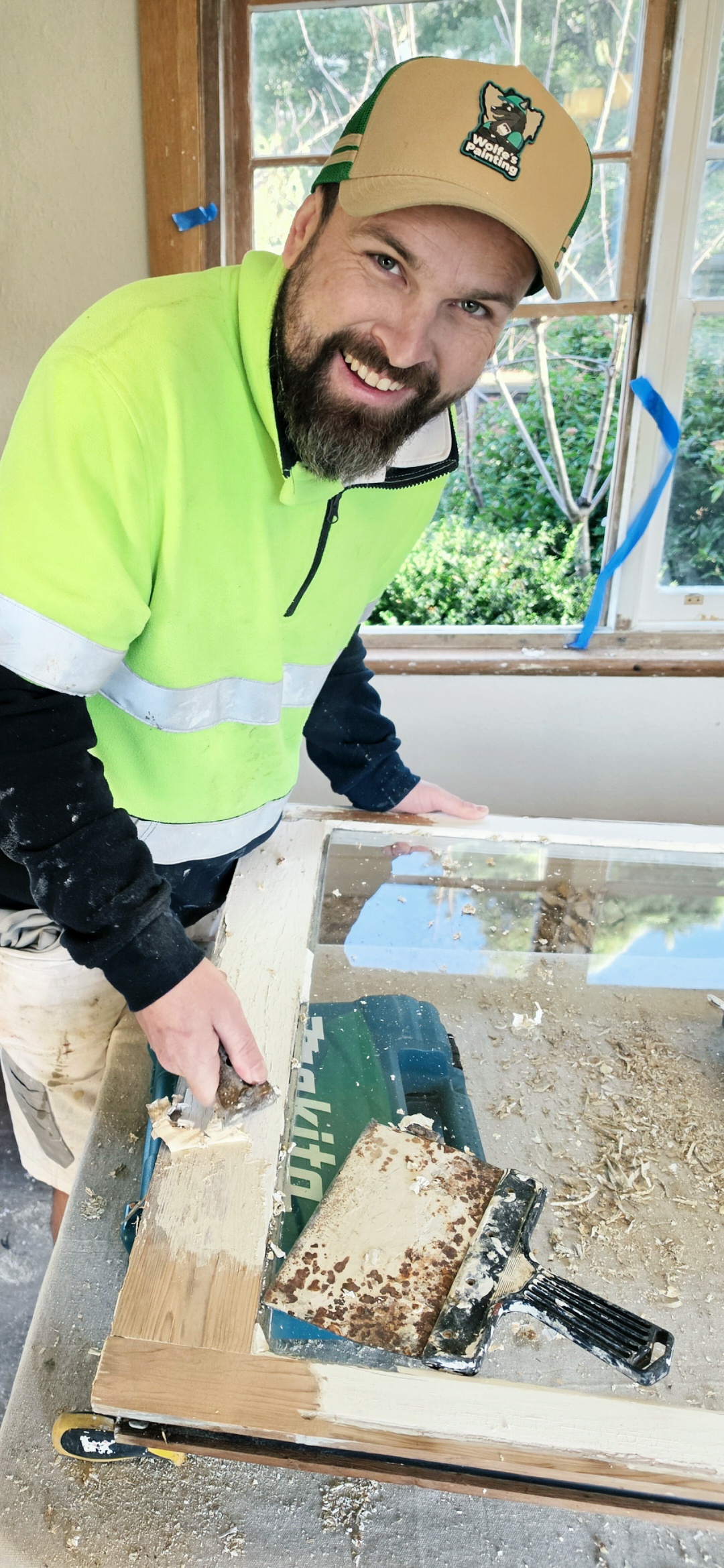 hobart-painter-scraping-timber-window-smile